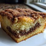 Close-up of a moist slice of Gluten-Free Cinnamon Sugar Coffee Cake with a thick cinnamon streusel topping.