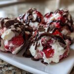 Close-up of several No-Bake Chocolate Strawberry Yogurt Clusters topped with chocolate drizzle and shavings.